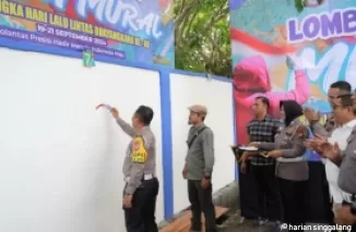 Dirlantas Polda Riau Ajak Seniman Riau Kampanye Tertib Lalu Lintas Melalui Mural