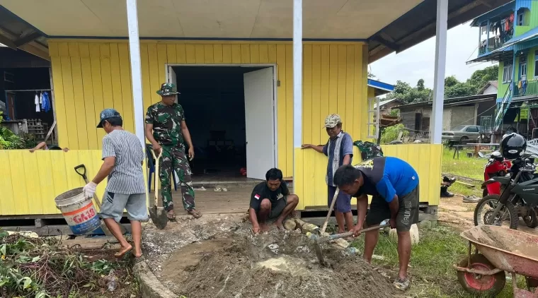 Satgas TMMD 122 Kodim 0914/TNT Melaksanakan Semenisasi Halaman Gereja GPDI