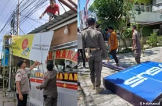 Tim Bapenda Padang tengah membongkar reklame yang membandel, Kamis (29/8/2024).(Foto: Bapenda Kota Padang)