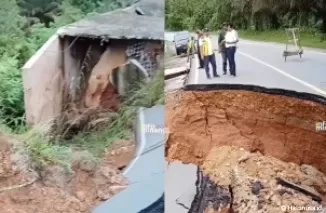 Kondisi ruas jalan yang amblas di Km 91, Desa Tanjung Alai, Kecamatan XIII Koto Kampar. (Foto: tangkapan layar video unggahan Instagram @infominang)