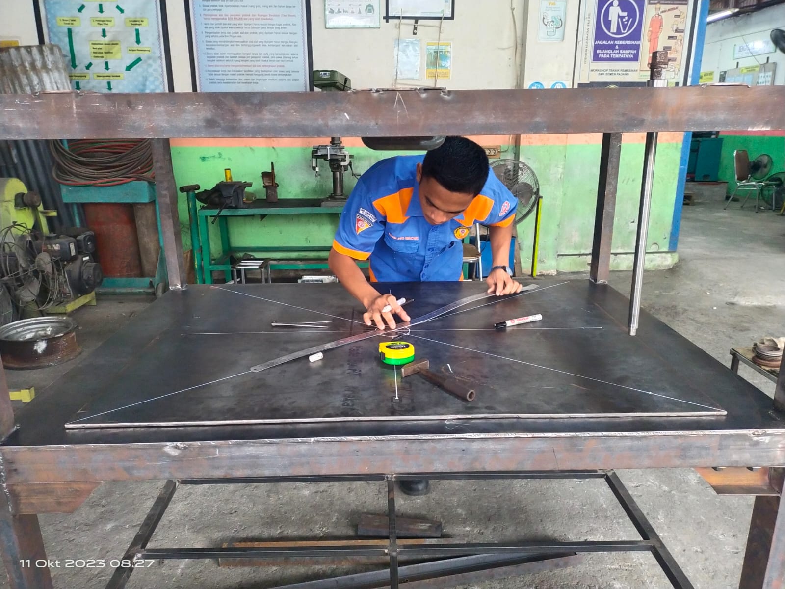 Foto SMK Semen Padang Produksi Mesin Press Restorasi untuk Arsip